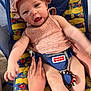 Ridgley joined the competition — help win amazing prizes! baby, infant, child, pink_clothing, hat, fisher_price, baby_seat, colorful, hands, support, cute, smiling, indoor, person, fabric, toy, playful, comfort, seat, portrait
