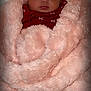 baby, sleeping, blanket, red_clothing, infant, soft_texture, cozy, face, peaceful, cute, newborn, wrapped, pink, portrait, resting, indoor, child, toddler, warm, snuggled
