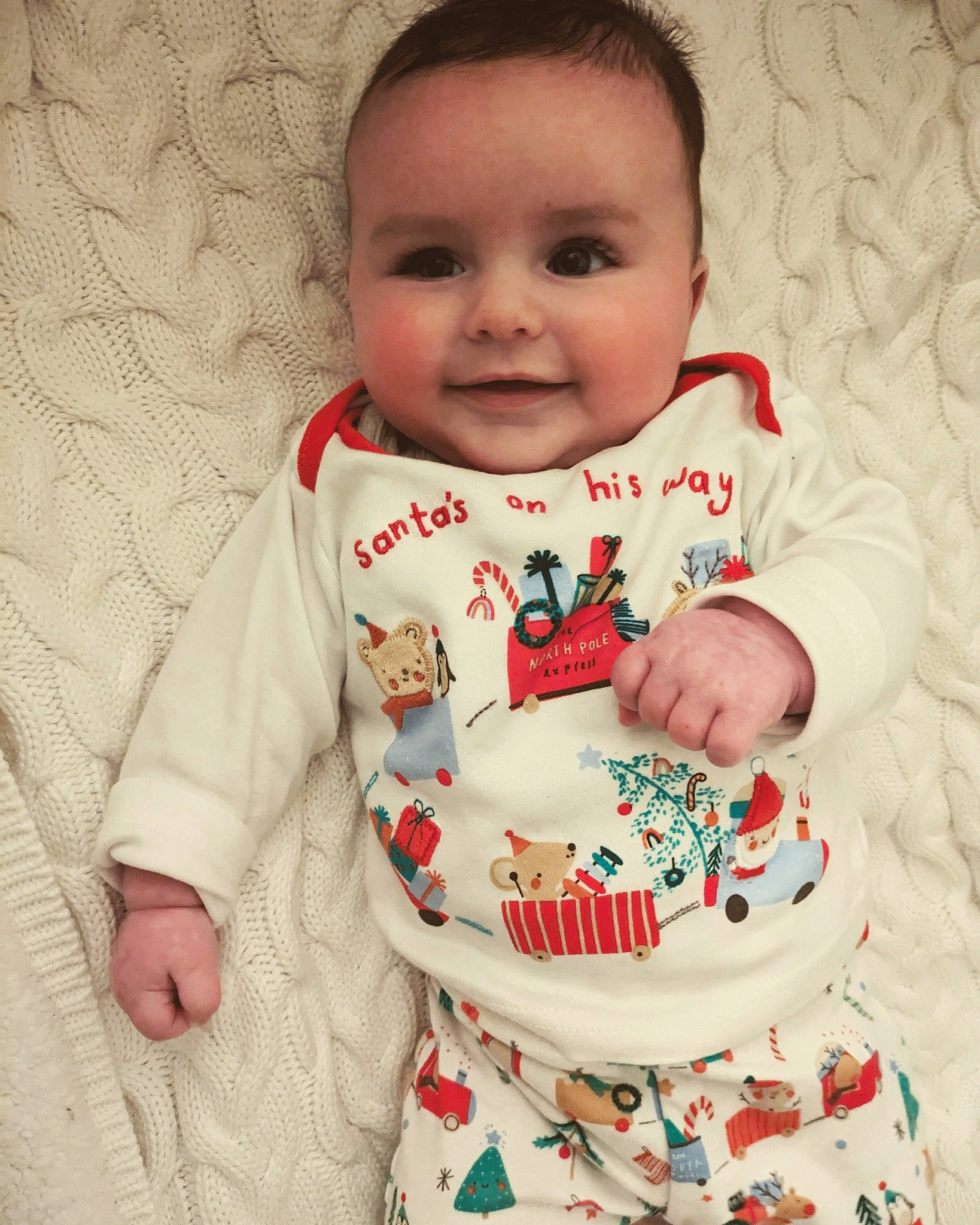 George joined the competition — help win amazing prizes! baby, baby_toddler_clothing, cheek, child, comfort, face, finger, happy, joy, linens, lip, outerwear, pattern, person, sitting, skin, sleeve, smile, sugar_cake, t_shirt