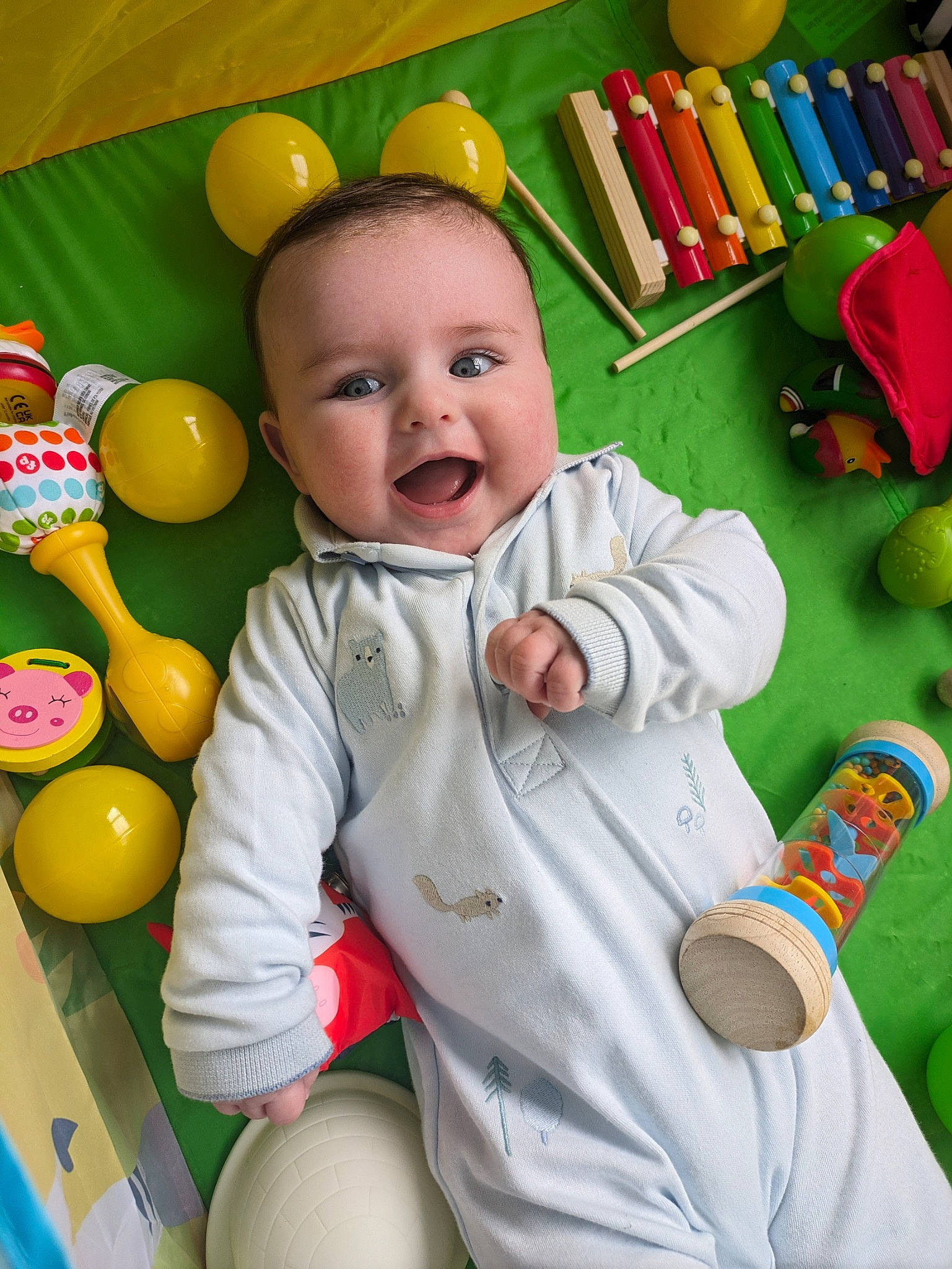 George joined the competition — help win amazing prizes! baby, baby_playing_with_toys, baby_products, baby_toddler_clothing, baby_toys, bookcase, cheek, child, fun, happy, joy, person, play, product, room, shelf, sleeve, smile, textile, toddler
