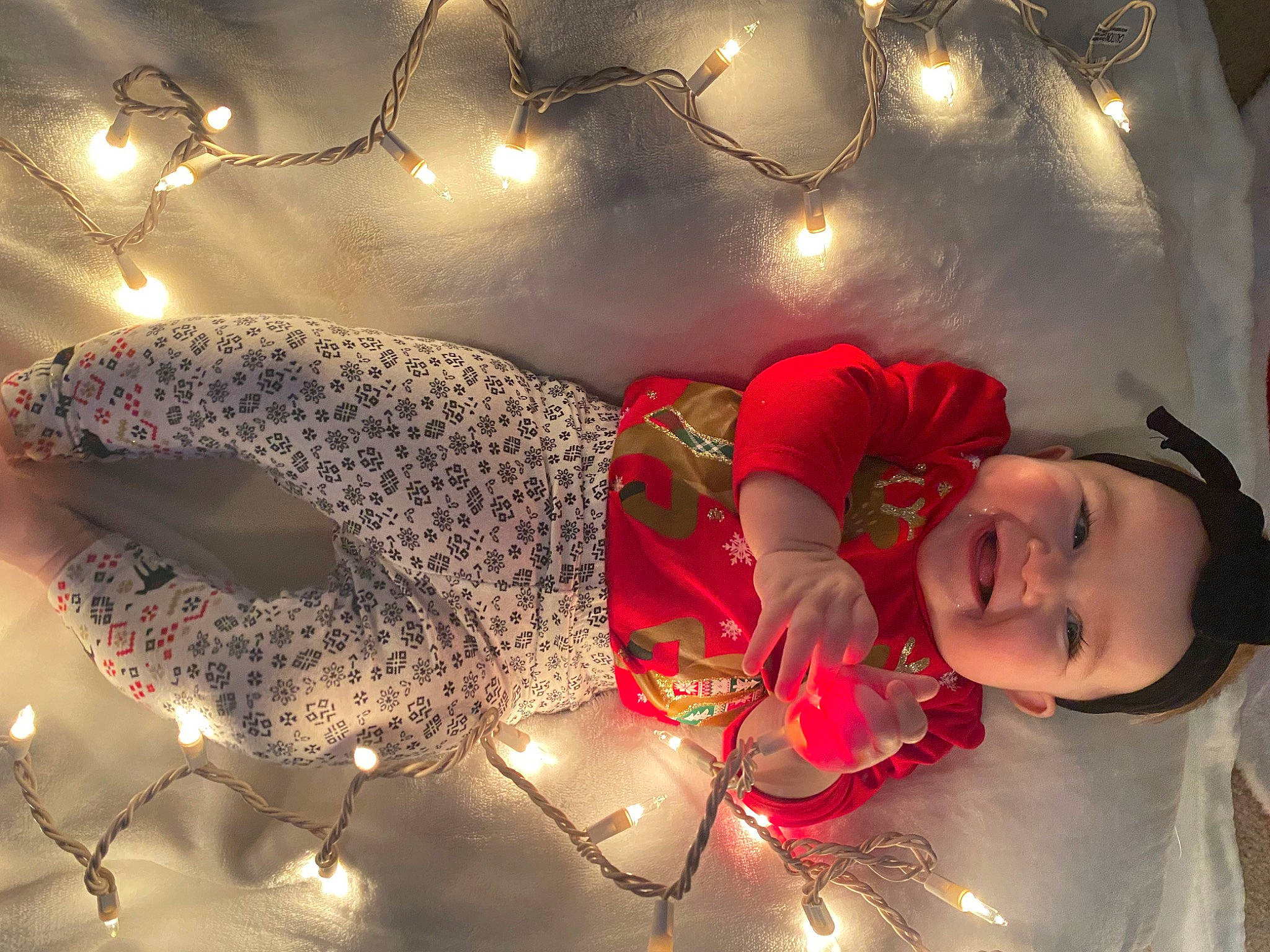 Miranda is registered to the contest to win money with this photo: carmine, christmas, christmas_decoration, christmas_eve, christmas_lights, christmas_ornament, darkness, event, flash_photography, freezing, fun, happy, holiday, joy, light, night, ornament, person, sky, smile