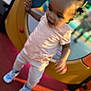 Jream joined the competition — help win amazing prizes! toddler, child, playground, play_equipment, sneakers, motion_blur, outdoor, casual_clothing, fun, curiosity, colorful, person, active, young_child, hair_buns, standing, red_surface, yellow_structure, daylight, blur