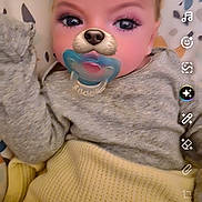 Kristopher joined the competition — help win amazing prizes! baby, pacifier, filter, leopard_ears, dog_nose, blanket, gray_clothing, yellow_blanket, face, infant, lying_down, patterned_background, cute, child, digital_filter, baby_clothes, indoors, portrait, closeup, soft_lighting
