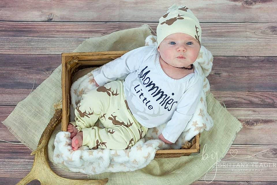 Bo is registered to the contest to win money with this photo: baby, baby_products, baby_safety, baby_toddler_clothing, cap, child, comfort, fashion_accessory, fawn, fur, happy, headgear, headwear, jewellery, linens, pattern, person, sitting, sleeve, toddler