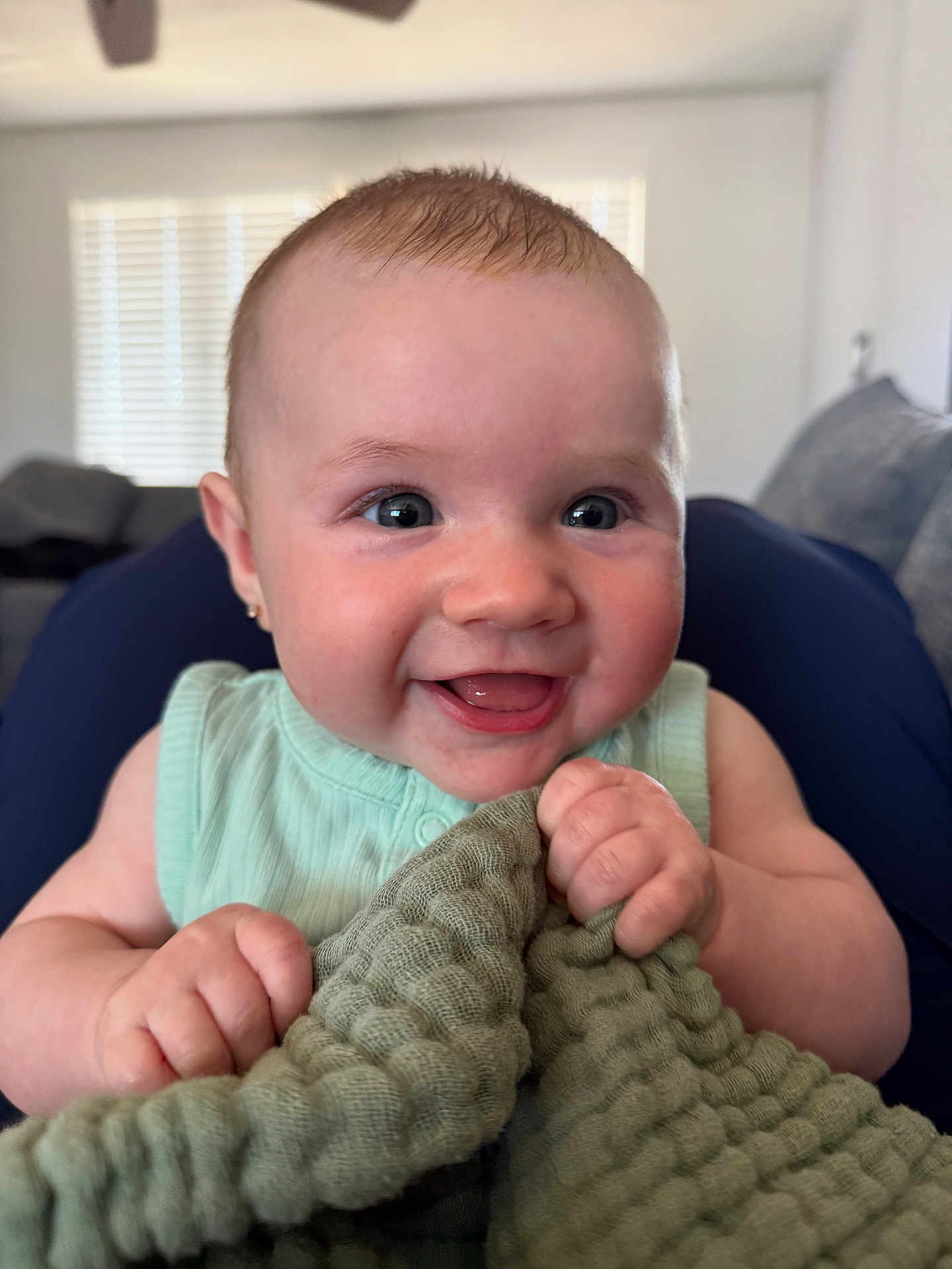 Leylanie joined the competition — help win amazing prizes! baby, smile, happy, infant, blanket, hand, face, indoor, person, clothing, cute, skin, head, expression, child, young, holding, texture, home, window