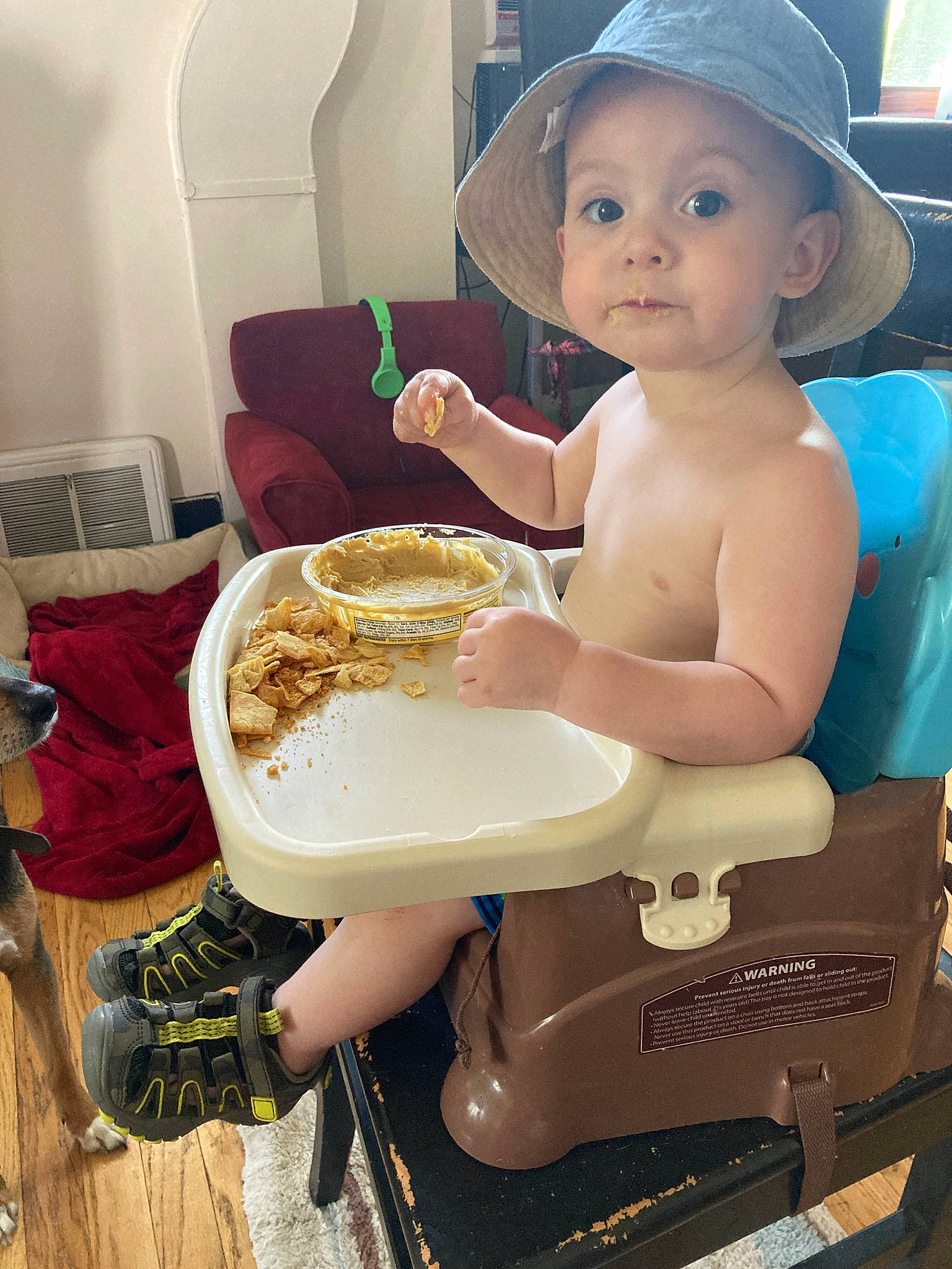Jaxen is registered to the contest to win money with this photo: breakfast, child, eating, food, hat, headgear, headwear, meal, person, sitting, toddler, vacation