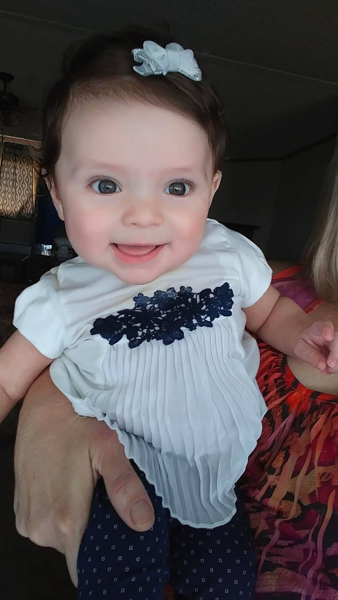 Ela is registered to the contest to win money with this photo: baby, baby_products, baby_toddler_clothing, cheek, child, costume, dress, fashion_accessory, hair_accessory, joy, person, product, skin, smile, toddler