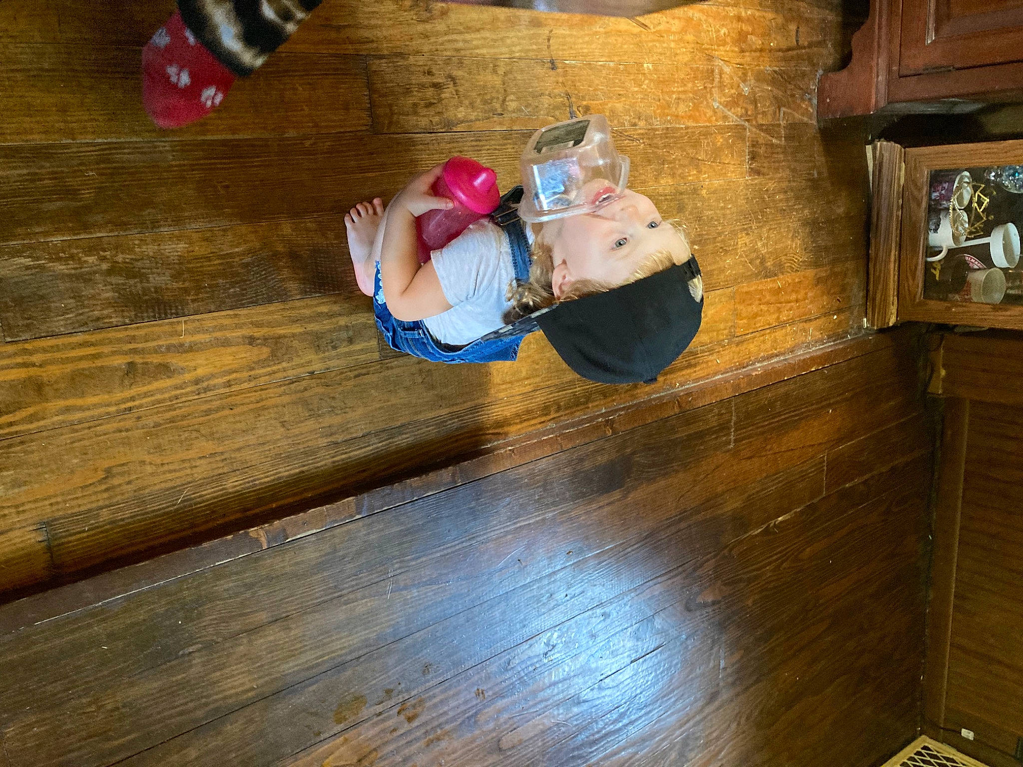 Nataliah joined the competition — help win amazing prizes! baby_toddler_clothing, brown, child, floor, flooring, fun, hardwood, headwear, human_leg, laminate_flooring, pattern, person, plank, plywood, room, sitting, television, toddler, varnish, wood