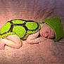 Selah is registered to the contest to win money with this photo: newborn, baby, sleeping, crocheted_clothing, green, turtle_costume, pink_blanket, soft_texture, infant, cute, peaceful, headwear, wrapped, lying_down, indoors, portrait, skin, small_hands, small_feet, resting