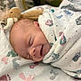 Selah joined the competition — help win amazing prizes! newborn, baby, smiling, wrapped, blanket, hospital, plush_toy, sleeping, face, infant, cozy, pattern, footprints, bed, cute, peaceful, child, portrait, indoors, soft