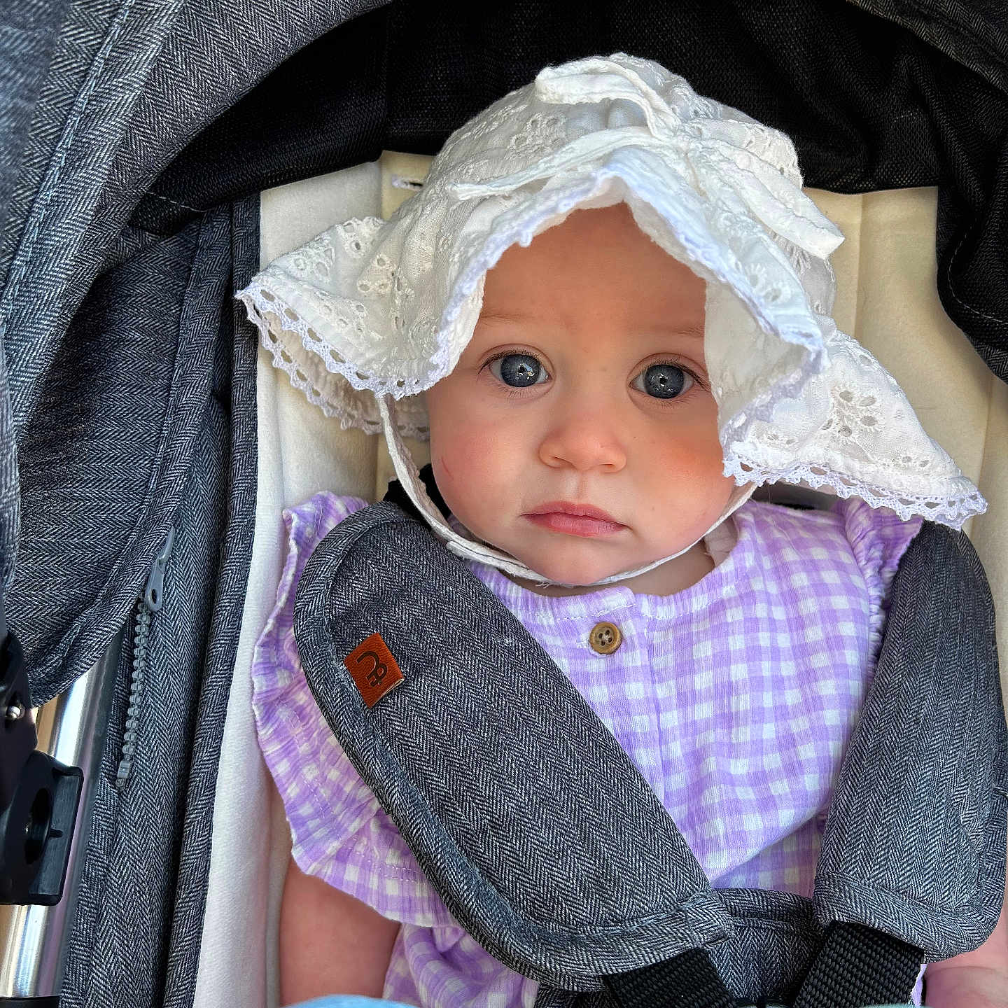 Violet is registered to the contest to win money with this photo: baby, balloon, bed, bonnet, cap, car, car_interior, clothing, face, furniture, hat, head, hood, person, photography, portrait, stroller, sunhat, transportation, vehicle