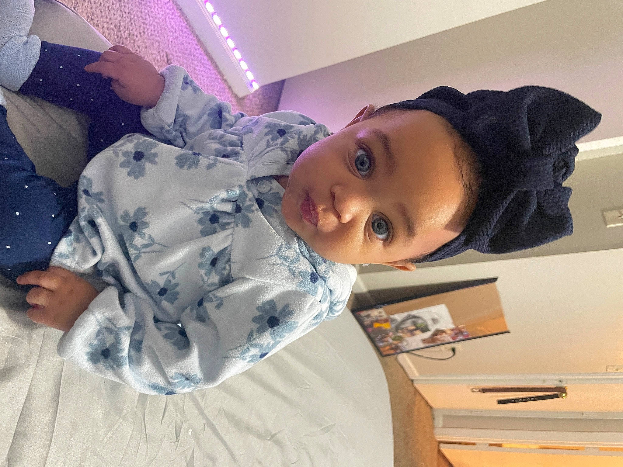 Emery is registered to the contest to win money with this photo: automotive_exterior, baby, baby_toddler_clothing, child, comfort, eye, fun, happy, hat, head, person, room, smile, toddler, vacation, vehicle_door