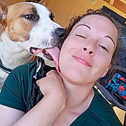 Baggy participe au concours pour gagner de l'argent avec cette photo : affection, background, canine, casual, closeup, dog, expression, face, friendship, happy, human, indoor, interaction, joy, licking, love, pet, skin, smiling, woman