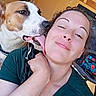 affection, background, canine, casual, closeup, dog, expression, face, friendship, happy, human, indoor, interaction, joy, licking, love, pet, skin, smiling, woman