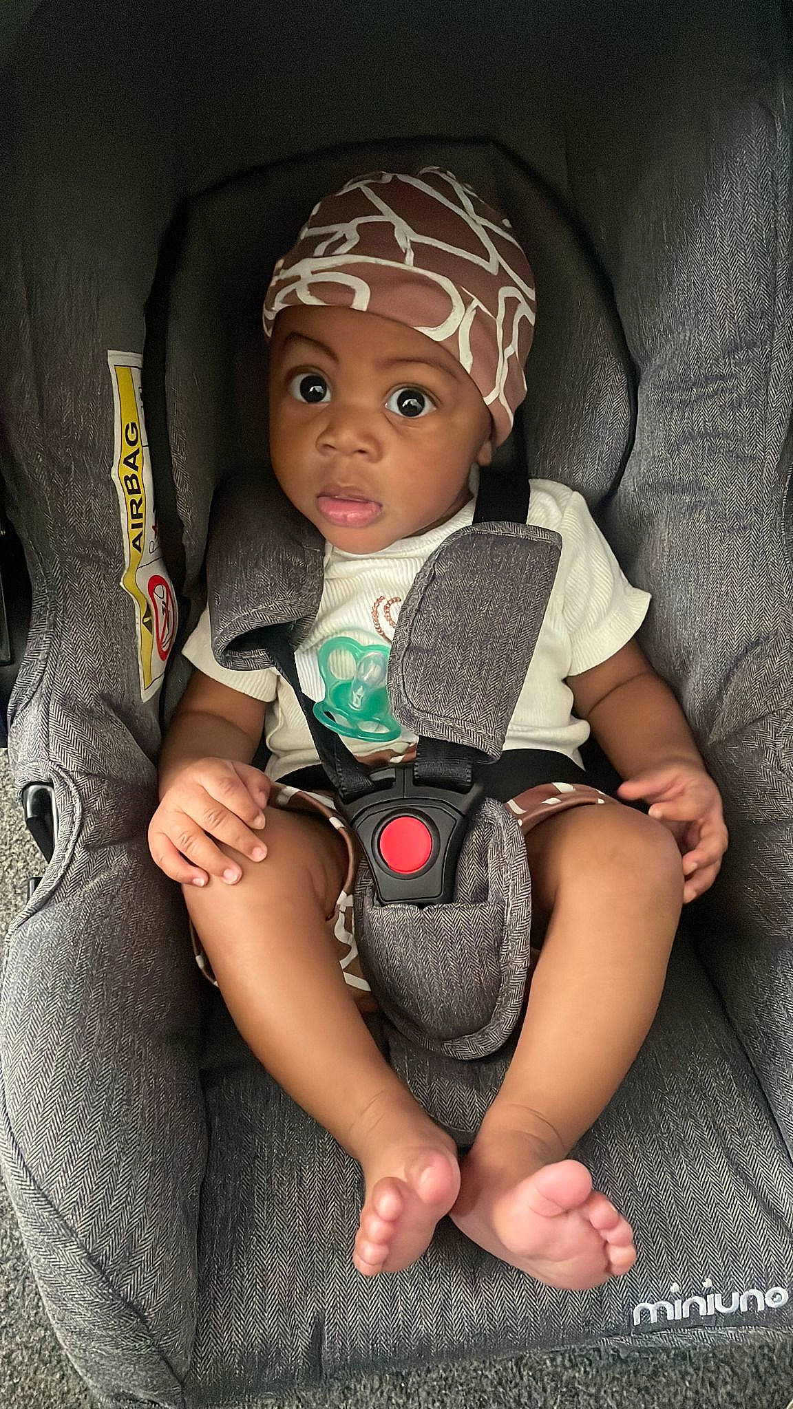 Isiah joined the competition — help win amazing prizes! baby, baby_products, baby_toddler_clothing, cap, car_seat, child, comfort, doll, eye, eyelash, fashion_accessory, finger, hand, headwear, human_leg, pattern, person, personal_protective_equipment, sitting, sleeve