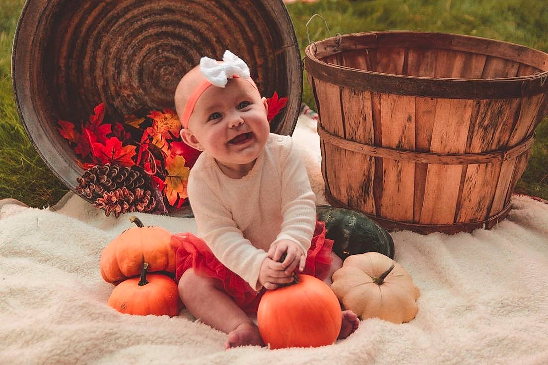 Brenleigh joined the competition — help win amazing prizes! baby, baby_toddler_clothing, child, comfort, facial_expression, fun, grass, happy, hat, headwear, human, jeans, leaf, orange, people_in_nature, person, photograph, plant, pumpkin, toddler