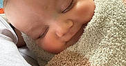 Westley is registered to the contest to win money with this photo: baby, sleeping, towel, blanket, closeup, face, infant, cozy, peaceful, rosy_cheeks, indoor, soft_texture, head, person, wrapped, resting, child, human, portrait, warm