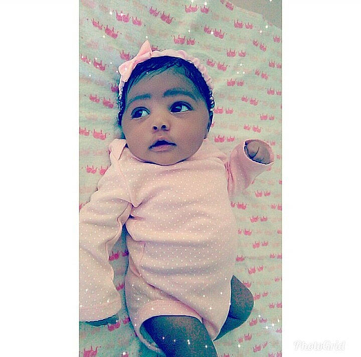 Amani is registered to the contest to win money with this photo: cheek, child, design, girl, hair_accessory, head, headgear, infant, material, pattern, person, product, textile, toddler