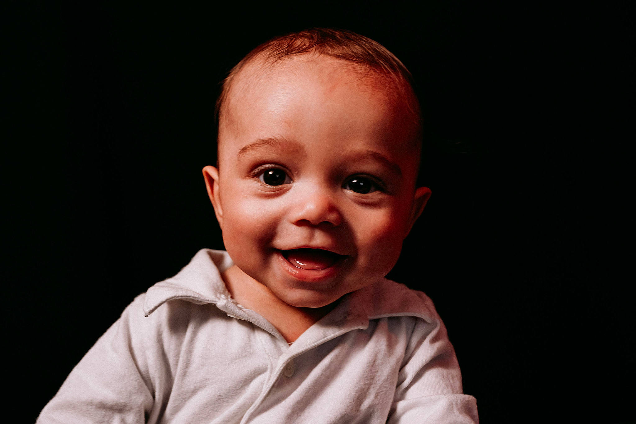 Legacy is registered to the contest to win money with this photo: baby, baby_toddler_clothing, cheek, child, comfort, darkness, ear, eyelash, flash_photography, fun, gesture, happy, laugh, monochrome_photography, nose, person, sleeve, smile, thumb, toddler