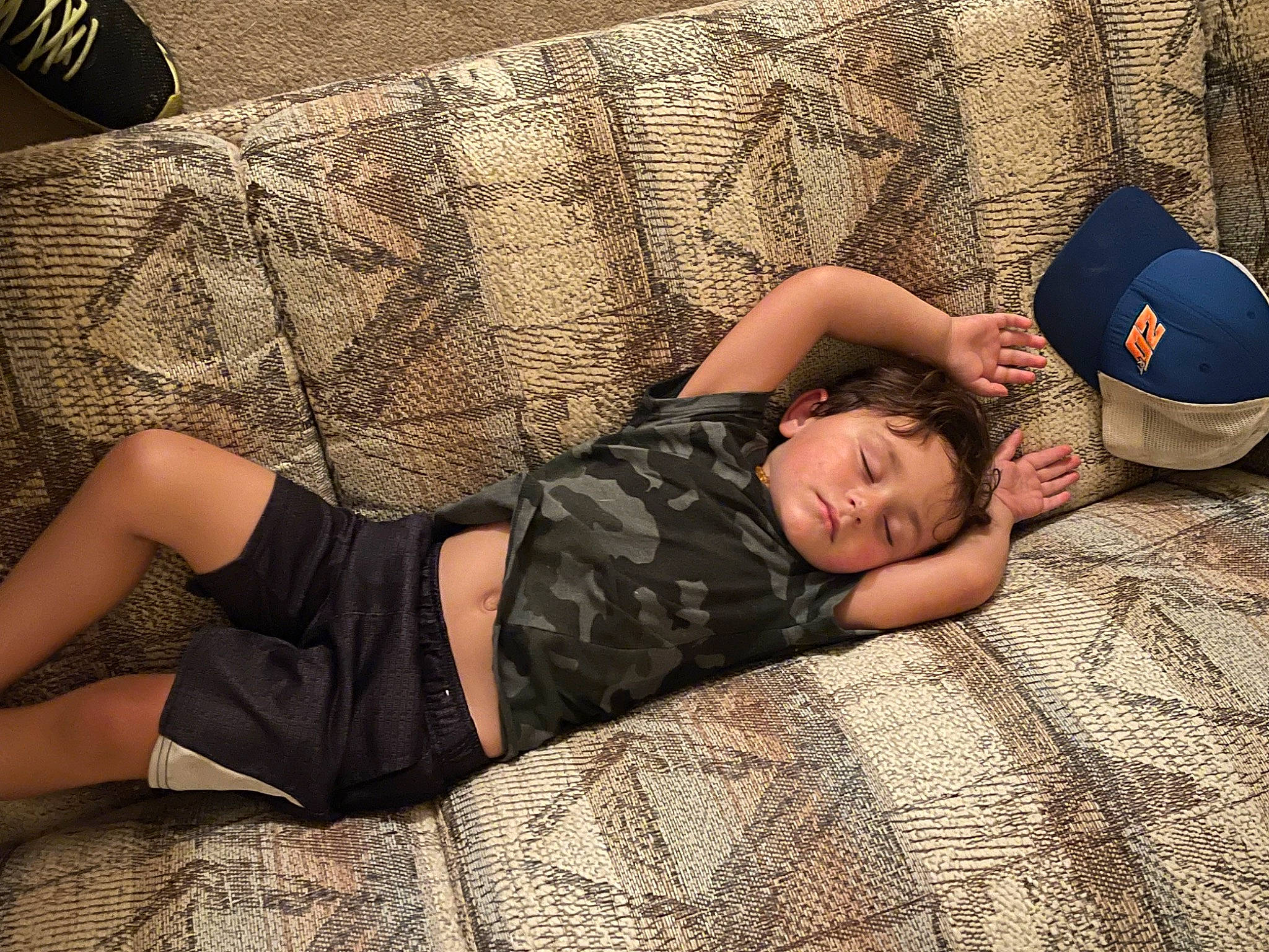 Harrison joined the competition — help win amazing prizes! blond, child, comfort, cool, couch, elbow, eyewear, flash_photography, flesh, floor, flooring, human_leg, knee, linens, pattern, person, room, sitting, thigh, toddler