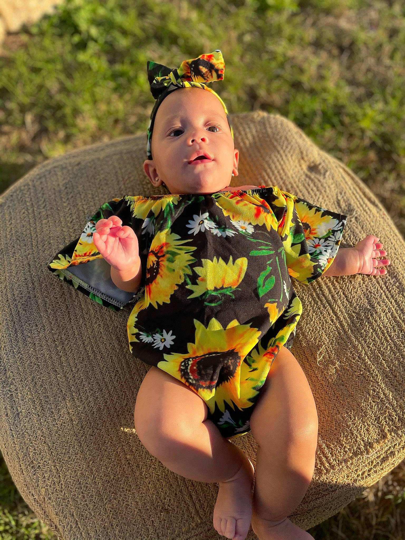 Jaelynn joined the competition — help win amazing prizes! baby_toddler_clothing, chair, child, dress, fashion_accessory, fawn, grass, happy, headpiece, human_leg, jewellery, pattern, people_in_nature, person, personal_protective_equipment, plant, sitting, spring, thigh, toddler