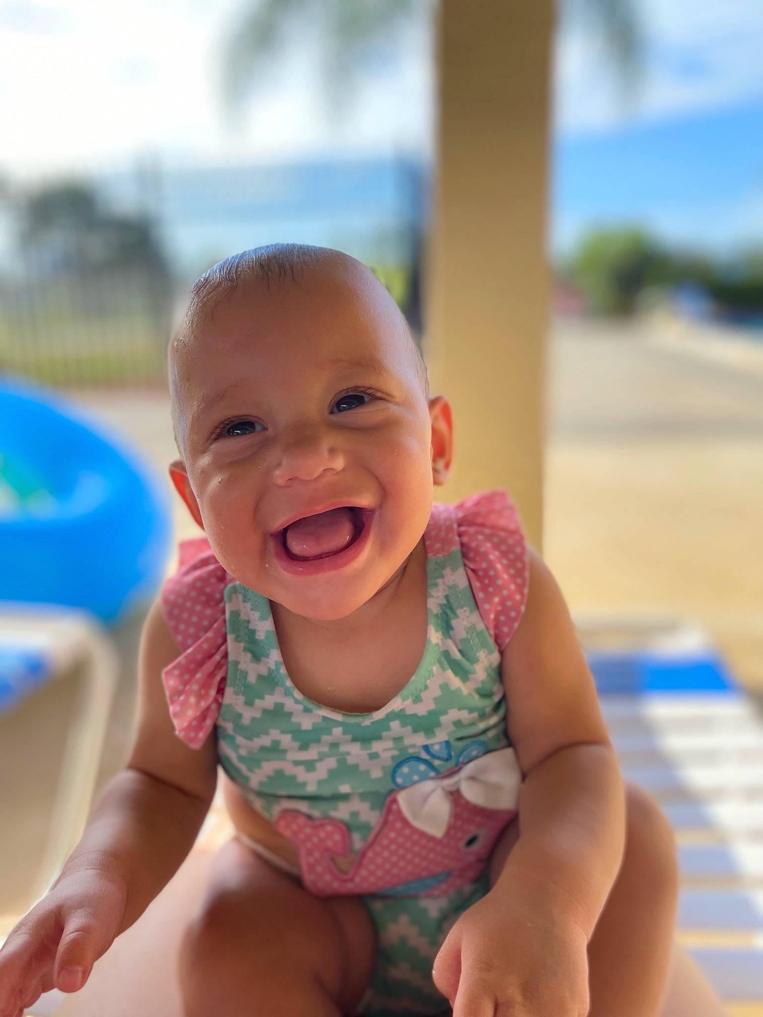 Jaelynn joined the competition — help win amazing prizes! baby, baby_toddler_clothing, blue, chin, eye, face, finger, foot, fun, grass, happy, human_body, leisure, mouth, people_in_nature, person, skin, sky, smile, thumb