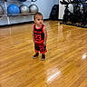 Nathaniel joined the competition — help win amazing prizes! toddler, child, gym, exercise_balls, stationary_bikes, wooden_floor, sportswear, jersey, indoor, fitness, young_child, person, floor_reflection, blue_balls, red_clothing, short_hair, curious_expression, shoes, walls, fitness_equipment