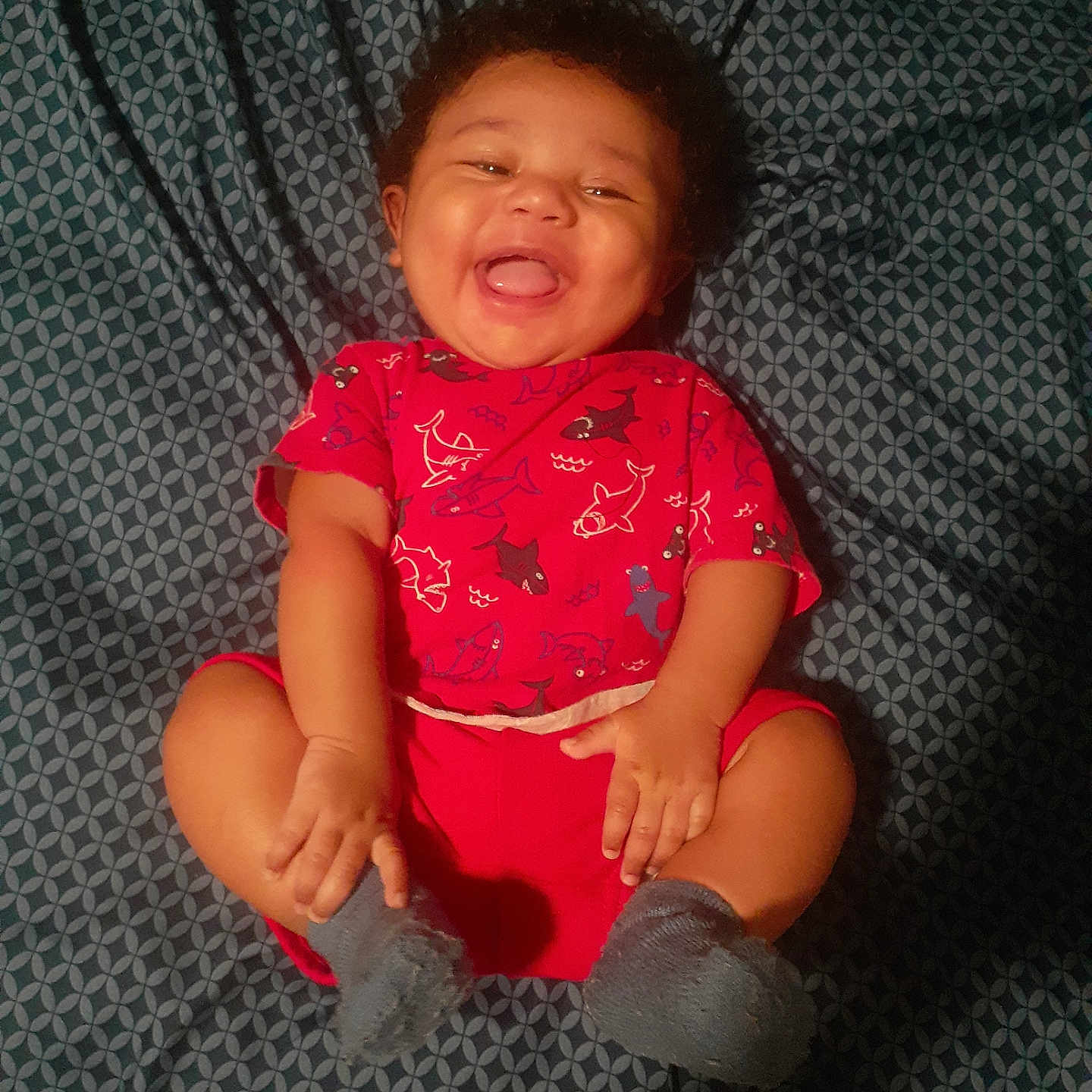 Jasper joined the competition — help win amazing prizes! baby, babylaughing, bodypart, clothing, dress, face, furniture, happy, head, laughing, mouth, pants, person, photography, portrait, shorts, sitting, smile, t_shirt, teeth