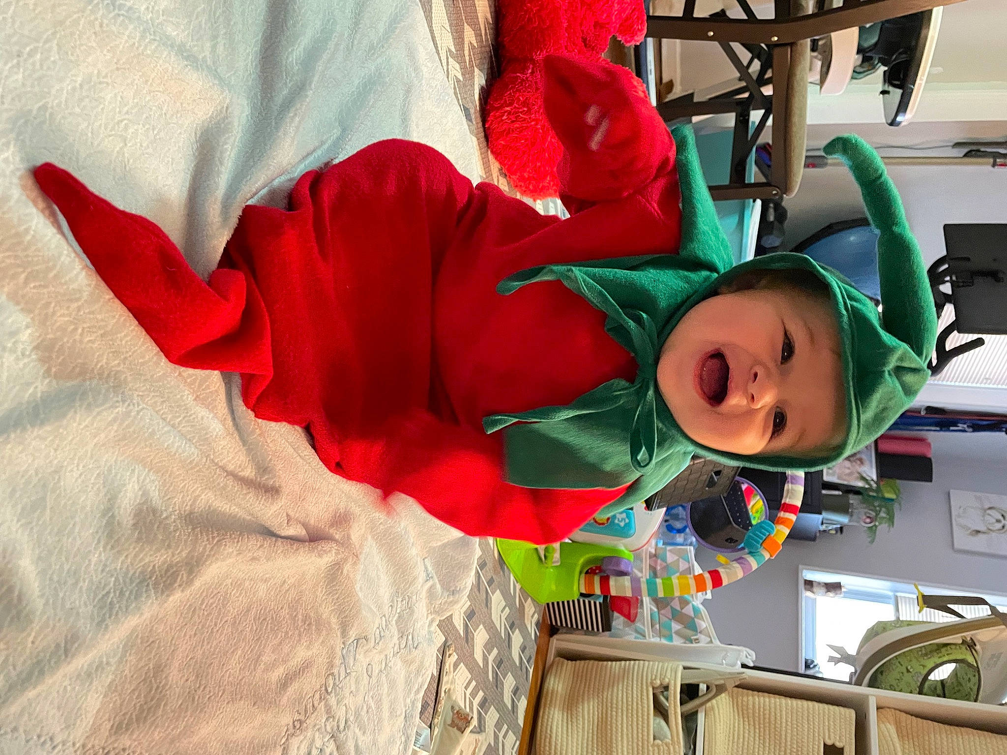Harrison joined the competition — help win amazing prizes! baby, carmine, child, christmas, christmas_eve, costume, costume_hat, event, fictional_character, fun, happy, hat, headwear, holiday, magenta, person, plant, room, sleeve, smile