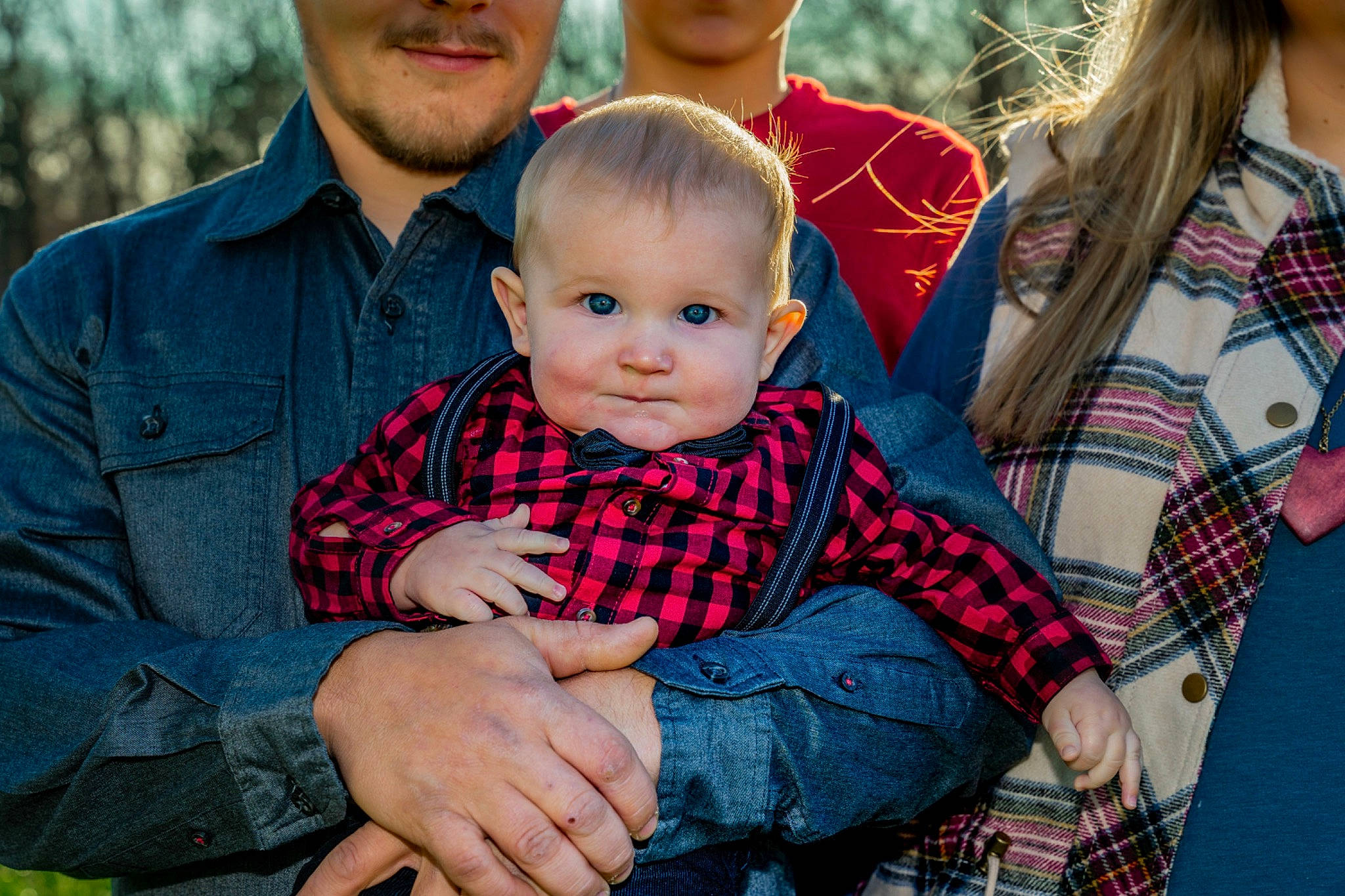 Oliver is registered to the contest to win money with this photo: baby, child, clothing, event, fun, grass, happy, holiday, jeans, lap, pattern, people_in_nature, person, plaid, plant, red, sitting, smile, tartan, toddler