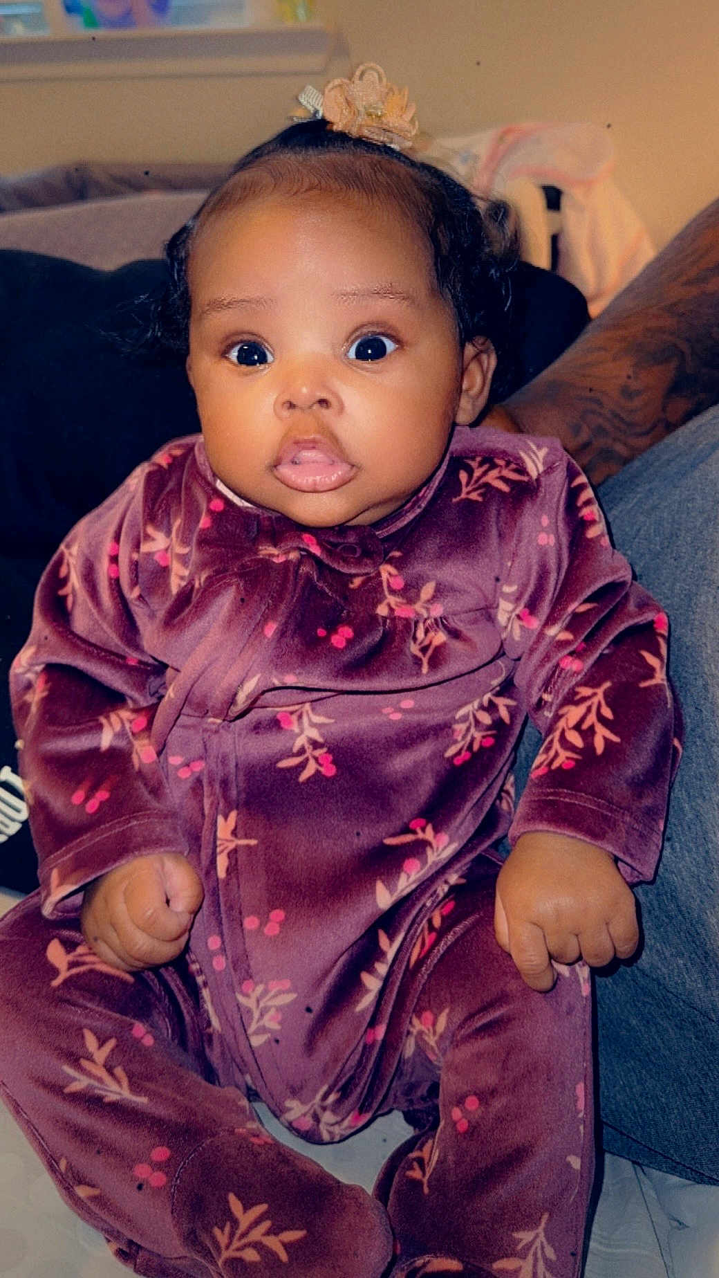 Marlie joined the competition — help win amazing prizes! baby, infant, child, closeup, surprised_eyes, onesie, velvet, floral_pattern, bow, chubby_cheeks, tiny_hands, tattooed_arm, sitting, indoor, portrait, expression_surprised, cute, face, window, blanket