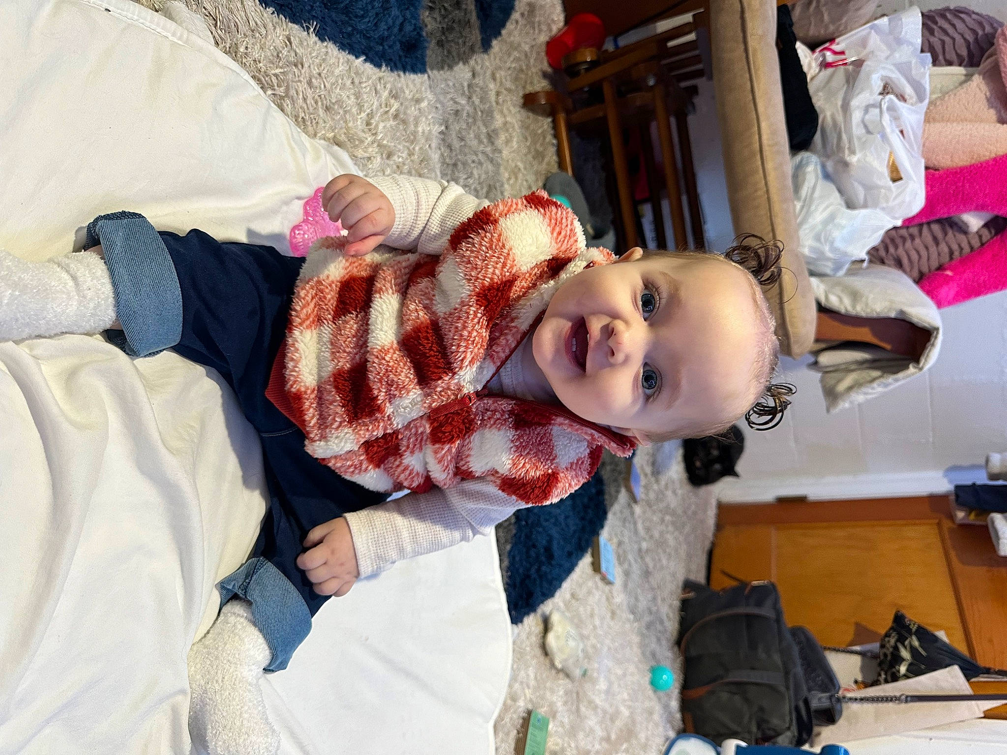 Koda is registered to the contest to win money with this photo: baby, child, doll, fun, fur, happy, linens, pattern, person, plaid, room, skin, smile, tartan, textile, toddler, toy, tradition, vacation, wood
