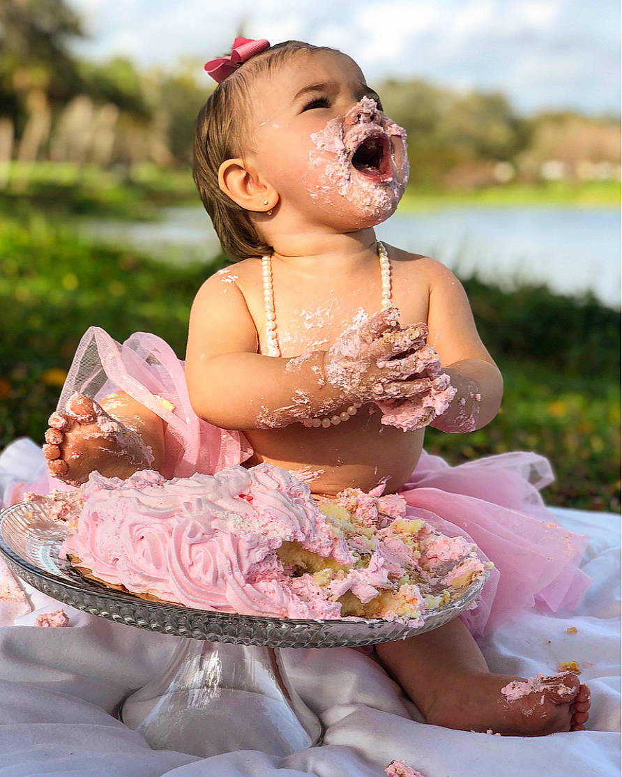 Aubrey is registered to the contest to win money with this photo: baby, child, daughter, dress, fun, hair_accessory, happy, person, photography, pink, skin, smile, summer, sweetness, textile, toddler, wedding_ceremony_supply