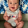 baby, smiling, sitting, blue_blanket, crocheted_blanket, happy, cute_outfit, infant, portrait, indoor, child, face, hands, feet, patterned_clothing, cozy, bright, cute, celebration_theme, person