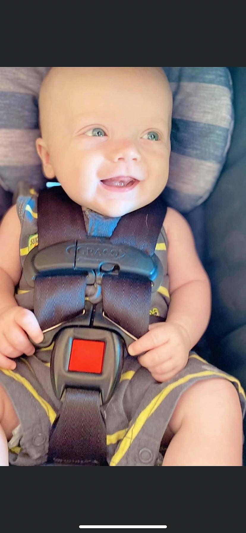 Wade is registered to the contest to win money with this photo: auto_part, baby, baby_carriage, baby_toddler_clothing, beauty, car_seat, cheek, child, comfort, electric_blue, face, finger, happy, person, photograph, product, seat_belt, skin, smile, thumb