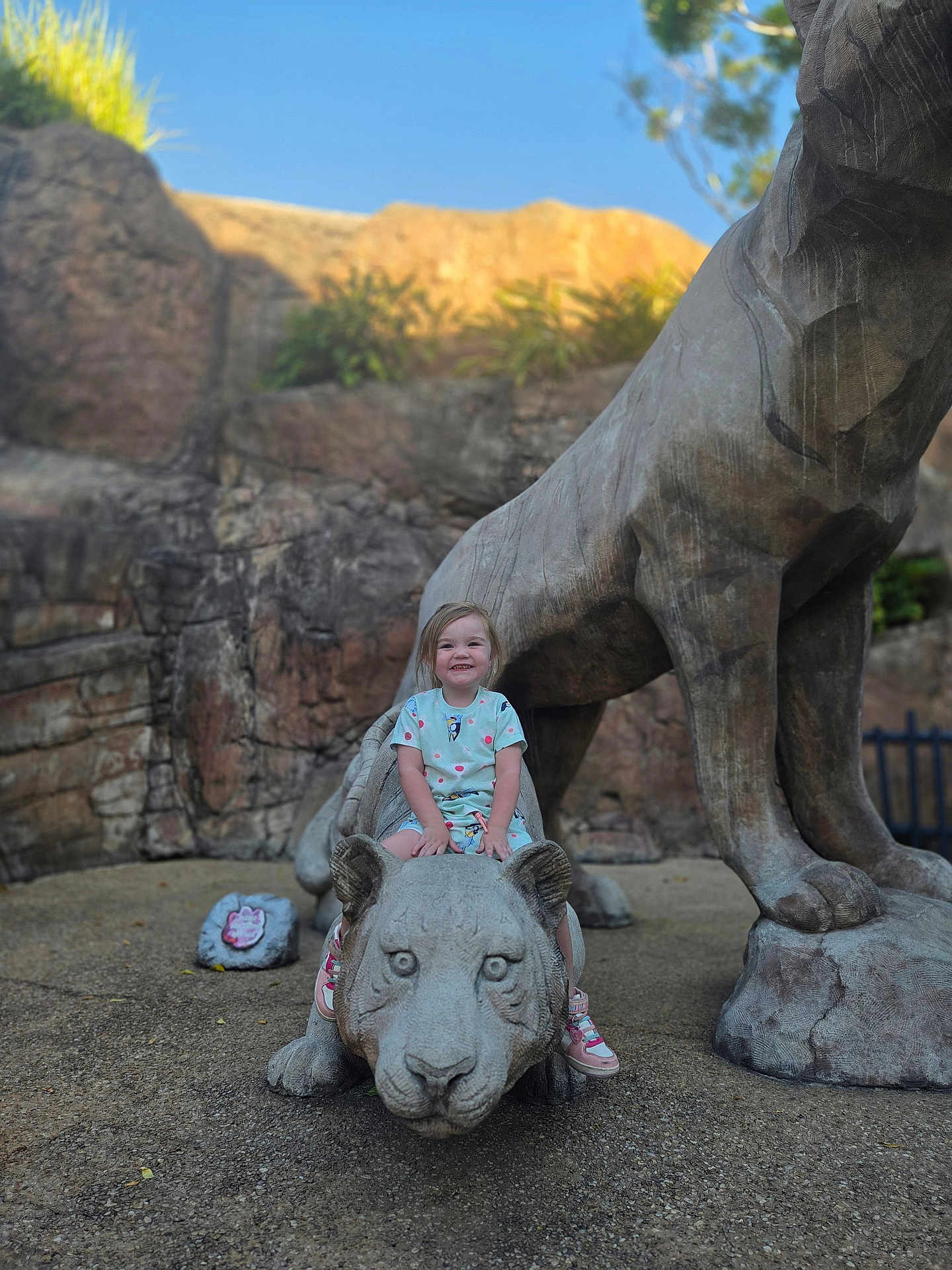 Diamond joined the competition — help win amazing prizes! child, statue, stone, big_cat, smile, outdoor, rock, playground, happy, person, footwear, clothing, nature, daylight, sculpture, young_child, casual, concrete, fun, adventure