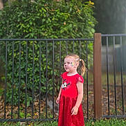 Diamond joined the competition — help win amazing prizes! casual_clothing, child, daylight, face_paint, fence, girl, grass, greenery, hair_clip, happy, minnie_mouse, nature, outdoor, playful, portrait, red_dress, smiling, sneakers, socks, standing