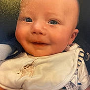 Hunter-Eli joined the competition — help win amazing prizes! baby, infant, smile, face, bib, striped_clothing, giraffe_design, closeup, portrait, child, cute, happy, young, apparel, soft_lighting, skin, eyes, mouth, head, cheeks