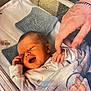 Hunter-Eli is registered to the contest to win money with this photo: baby, newborn, hospital, bassinet, blanket, smile, hand, adult_hand, infant, cozy, sleeping, cute, person, bed, clothing, tenderness, bonding, comfort, soft, happy