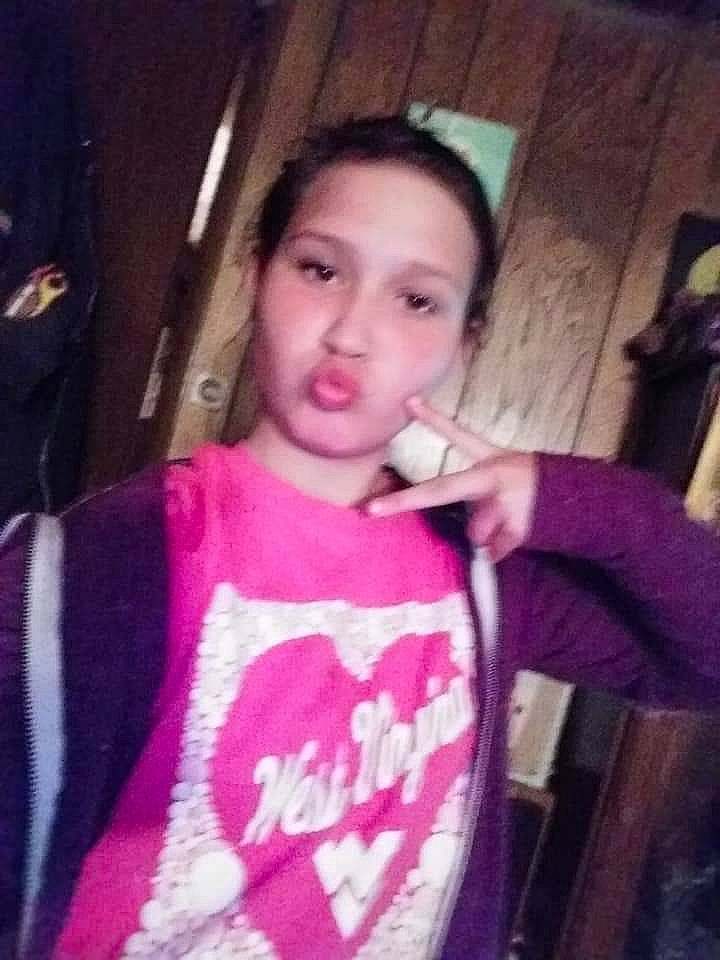 Kaitlyn is registered to the contest to win money with this photo: cheek, child, chin, cool, eyebrow, face, forehead, fun, hair, hairstyle, head, jaw, lip, long_hair, mouth, nose, person, photography, pink, selfie