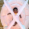 Fawlyn joined the competition — help win amazing prizes! baby, infant, play_mat, plush, pink, soft, cushion, child, cute, indoor, carpet, person, adorable, lying_down, wide_eyes, curious, crossbars, toy, young_child, comfort