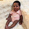 baby, infant, smiling, pink_onesie, fluffy_blanket, happy, tongue_out, cute, child, portrait, indoor, cozy, soft_texture, sitting, young, person, skin, hair, furniture, relaxed