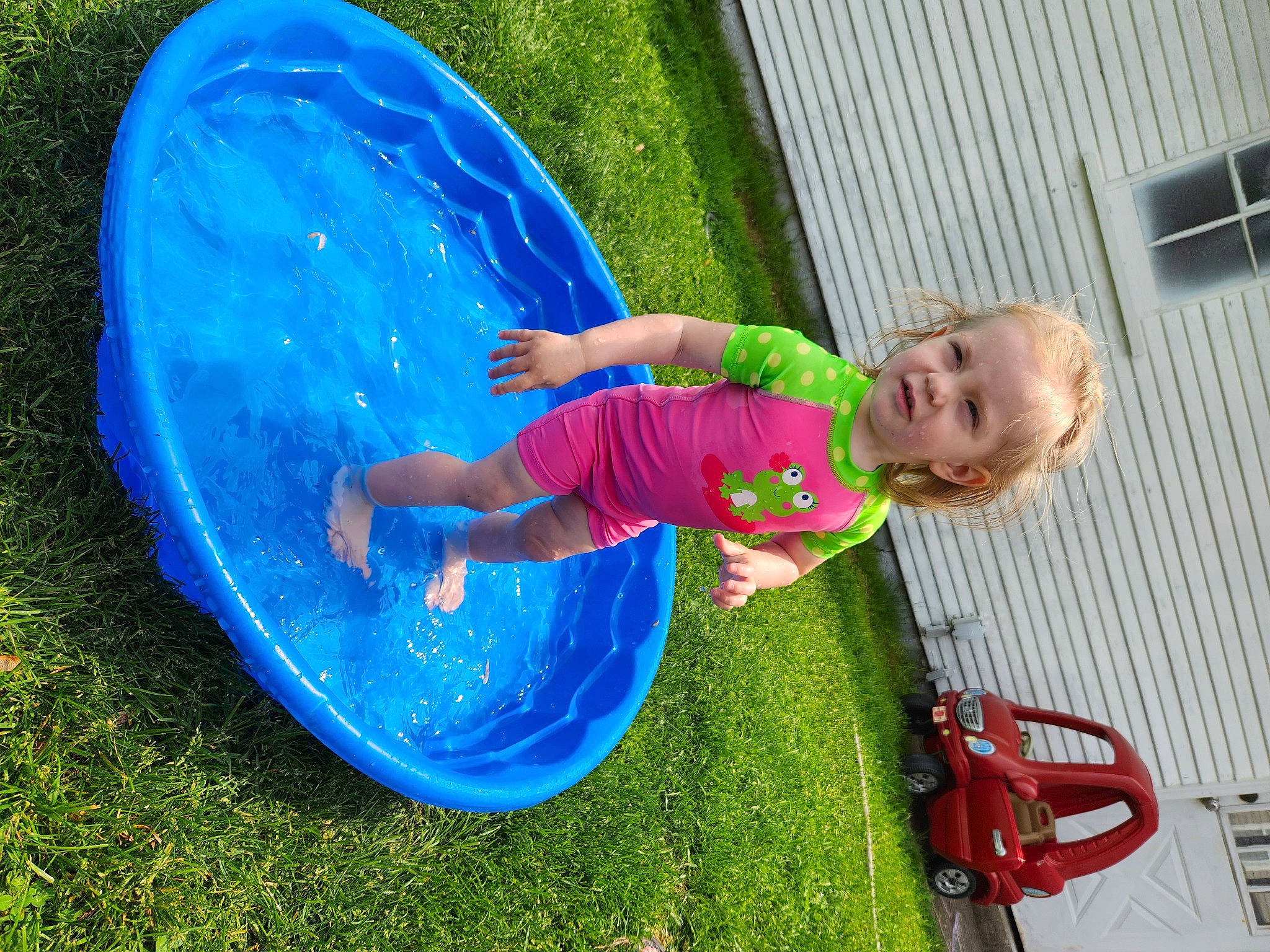 Eleanor joined the competition — help win amazing prizes! baby, baby_toddler_clothing, blue, child, electric_blue, fun, grass, green, happy, leisure, magenta, people_in_nature, person, plant, play, recreation, smile, toddler, vacation, water