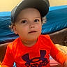 Kingston joined the competition — help win amazing prizes! blanket, boy, cap, casual_clothing, child, couch, curly_hair, cute, expression, face, furniture, home, indoor, orange_shirt, person, portrait, sitting, toddler, under_armour, young_child