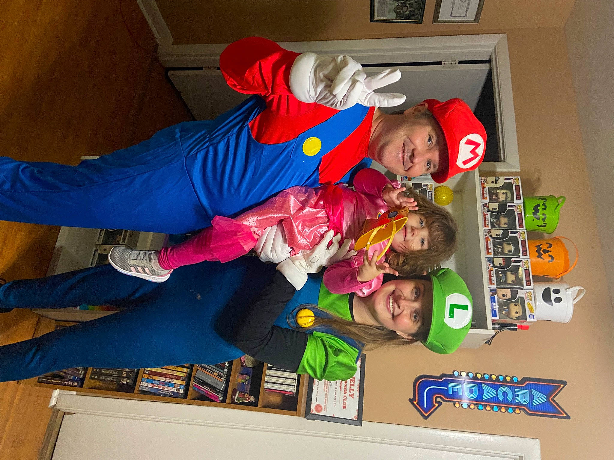 Alice is registered to the contest to win money with this photo: animation, child, costume, electric_blue, fiction, fictional_character, flooring, fun, games, hat, headwear, joy, person, play, recreation, room, sportswear