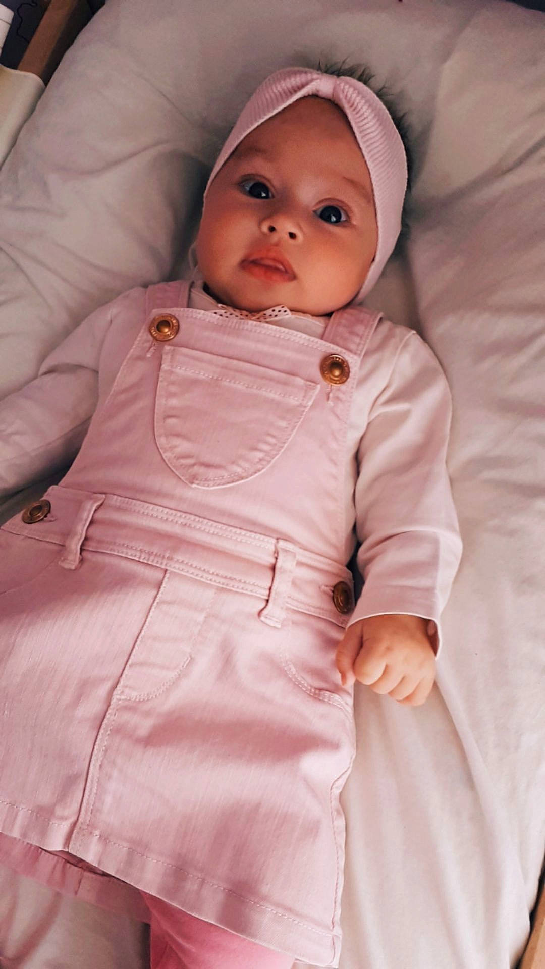 Eva participe au concours pour gagner de l'argent avec cette photo : baby, cheek, child, coat, outerwear, peach, person, pink, skin, toddler