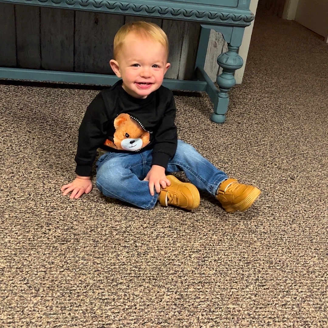 Matteo joined the competition — help win amazing prizes! bodypart, boy, cabinet, child, clothing, drawer, face, finger, footwear, furniture, hand, head, jeans, male, pants, person, photography, portrait, shoe, sitting