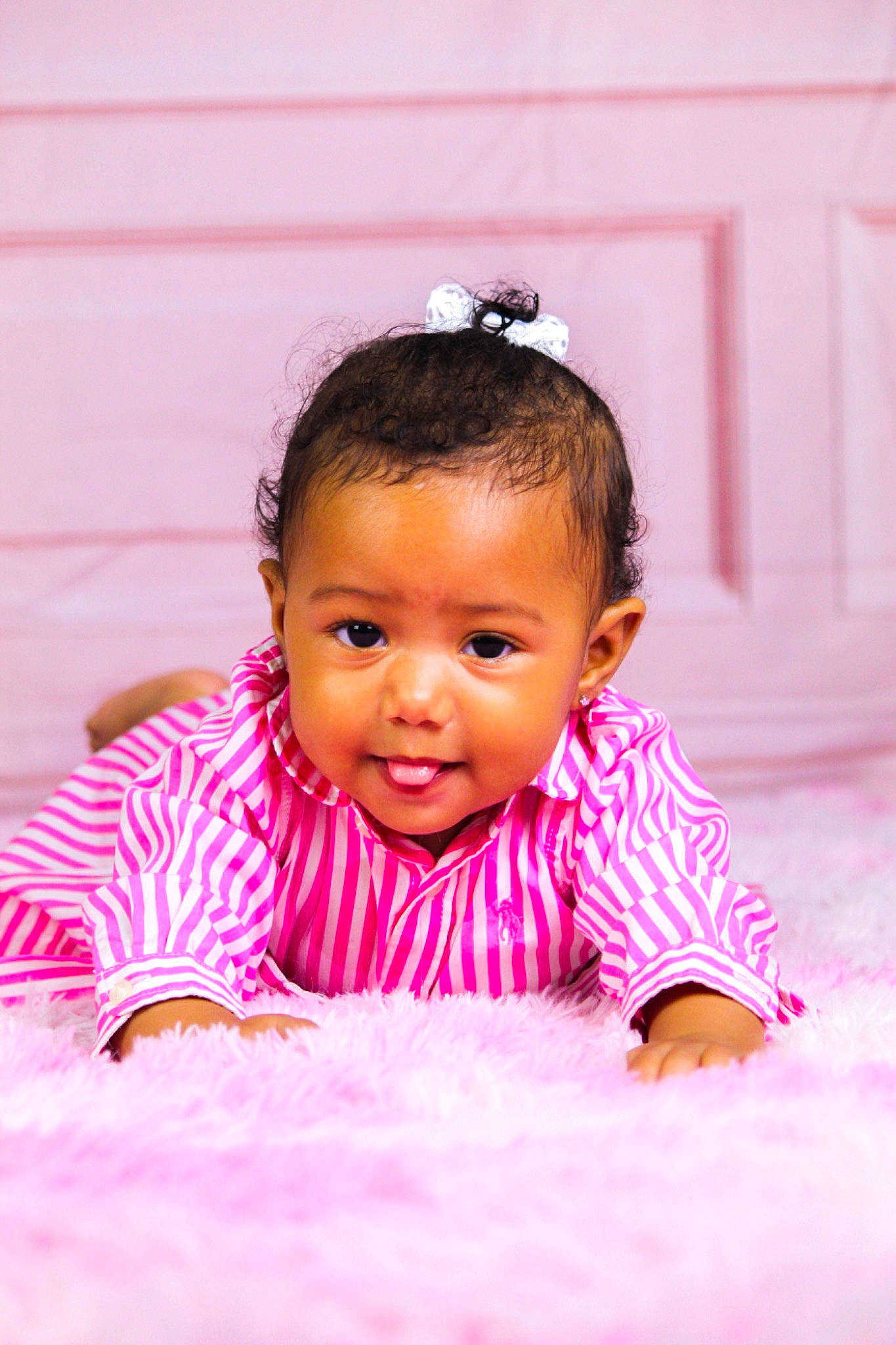 Amelia is registered to the contest to win money with this photo: baby, baby_toddler_clothing, cheek, child, crawling, eyelash, face, flash_photography, flooring, fun, happy, iris, leisure, magenta, nose, person, pink, play, skin, smile