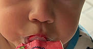 Lorenzo joined the competition — help win amazing prizes! big_eyes, cartoon_character, child, close_up, drinking, eyelashes, face, food, hair, indoor, mouth, portrait, product_packaging, smiling, snack, stitch, toddler, video_call, woman_face, yogurt_pouch