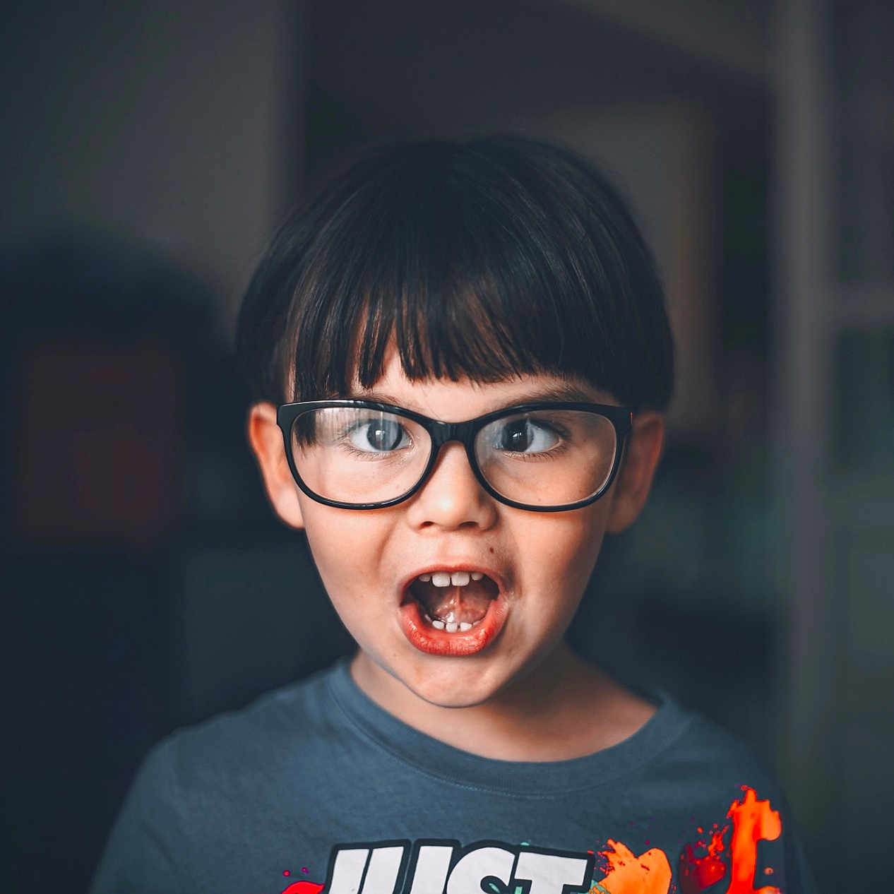 Damian is registered to the contest to win money with this photo: accessories, boy, child, eating, face, food, glasses, head, male, person, photography, portrait, surprised